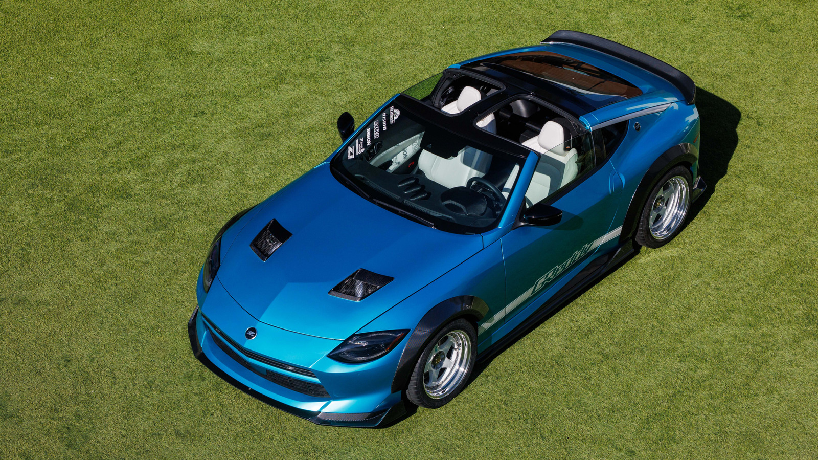Blue Nissan Z Kaze Concept with T-tops parked on grass