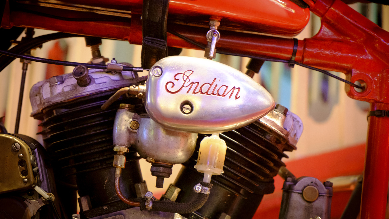 Close-up of vintage Indian motorcycle engine with Indian script badge