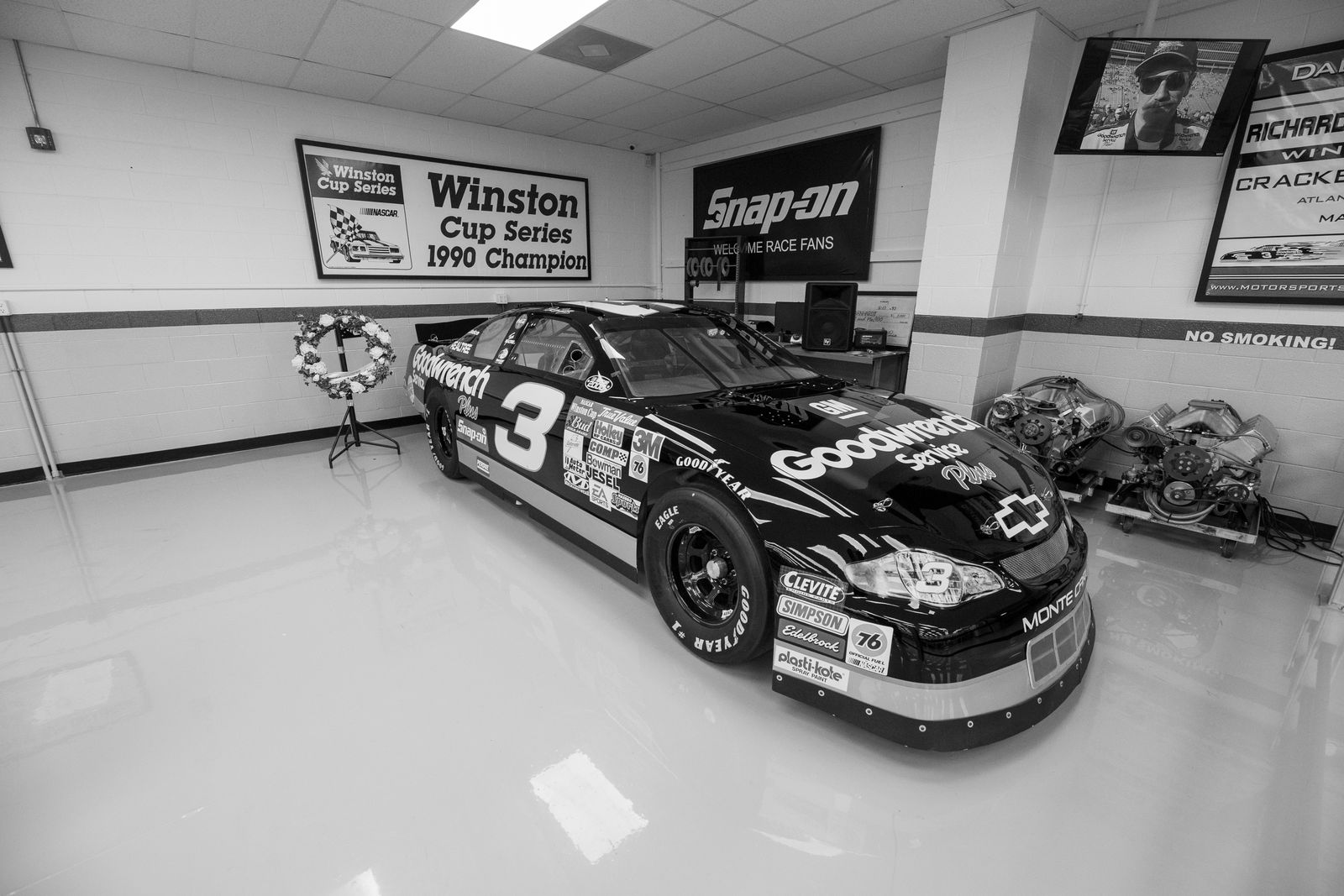 Black and White NASCAR Race Car in Garage Museum