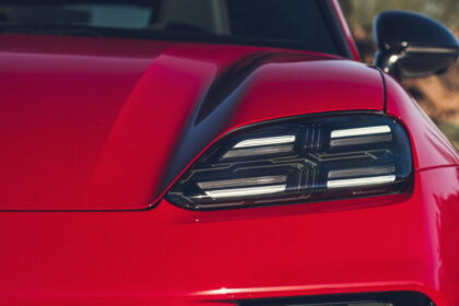 Close-up of a modern LED car headlight on a red vehicle
