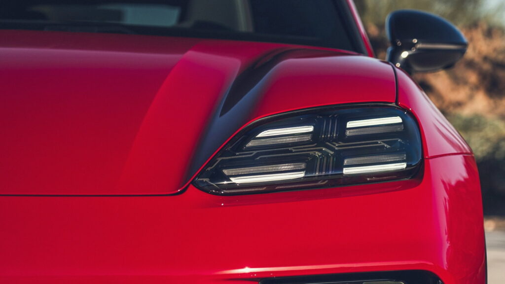 Close-up of a modern LED car headlight on a red vehicle