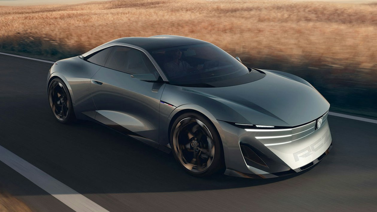 Silver Peugeot RCZ Vision sports car driving on a road Silver Peugeot RCZ Vision sports car driving on a road