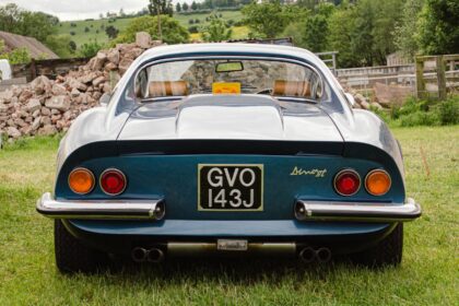 Ferrari Dino GT Parked on Green Grass Field