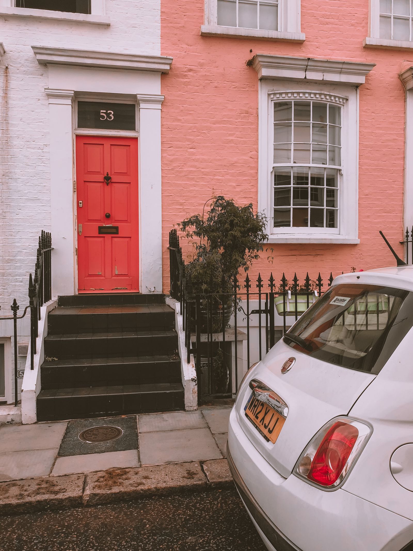 Parked Car outside a House