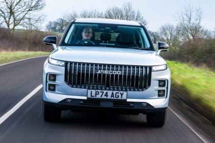 Silver JAECOO SUV driving on a rural road