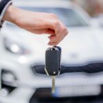 Person Holding a Car Key