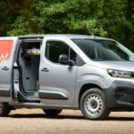 Silver Citroen Pawlingo concept van with dog graphics and open doors