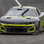 Black Chevrolet Camaro Driving on a Race Track