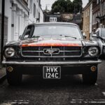 Selective Focus Photography of Black Ford Mustang Car